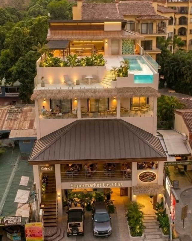 Aerial view of Naia's rooftop above Iguana Surf Boutique Hotel at dusk, Tamarindo